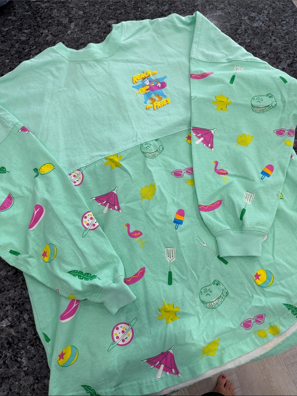 Disney Spirit Jersey Mint Green Long Sleeve Top with Toy Story Graphics